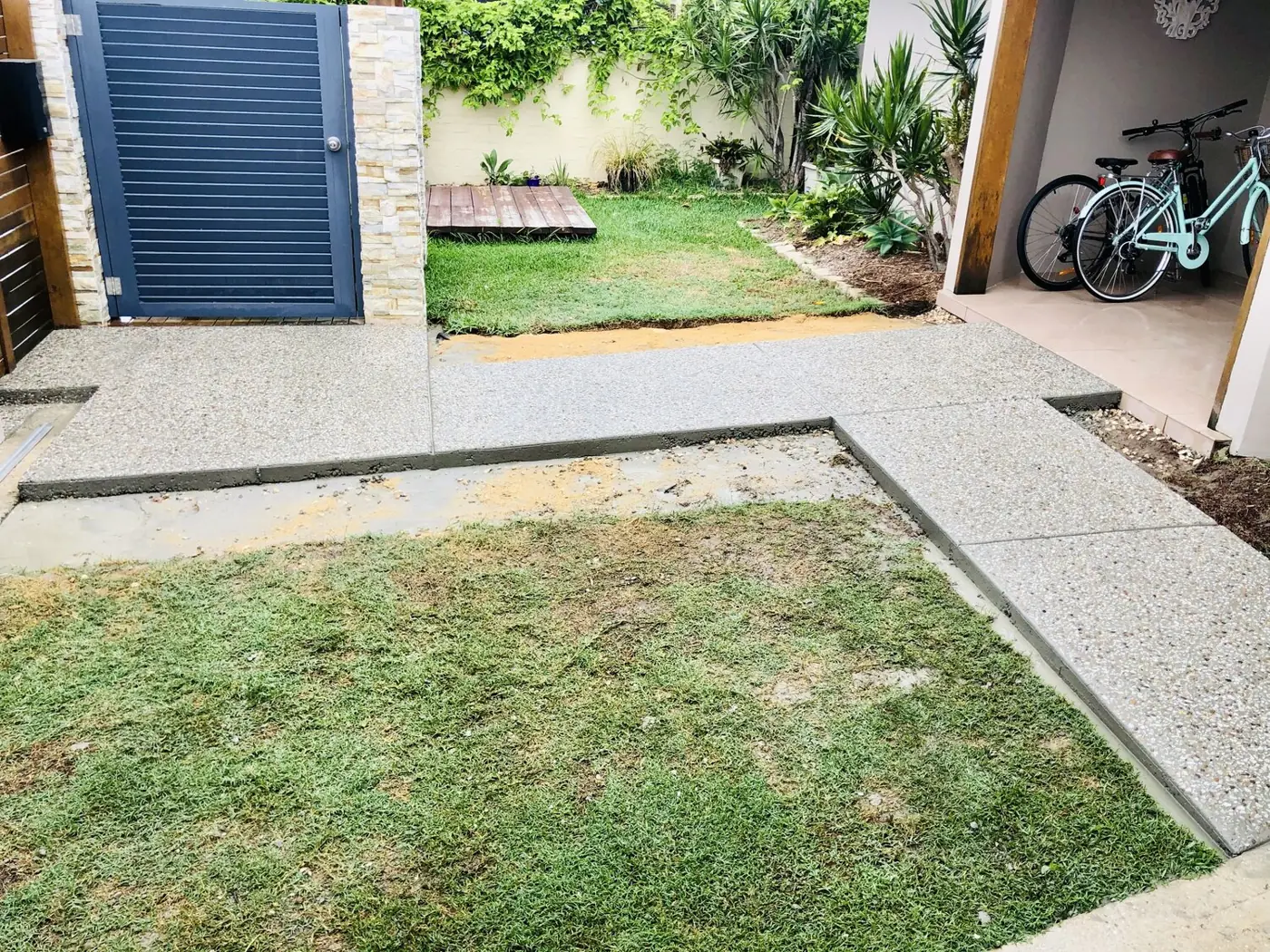 Exposed aggregate path through a garden